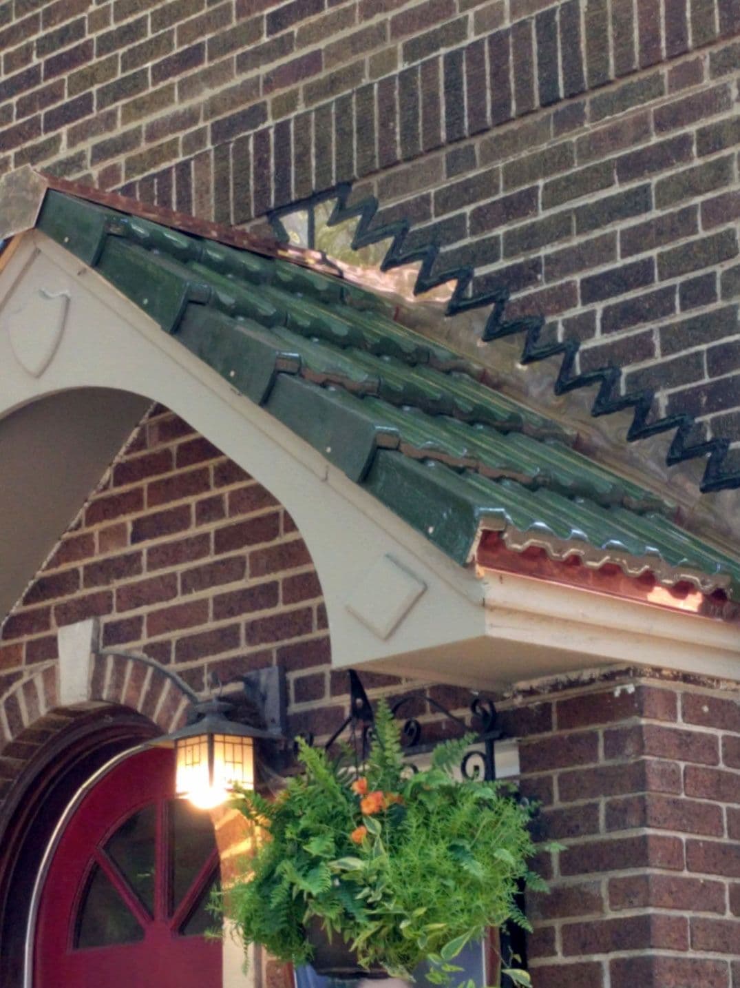 New tile porch roof and copper flashings.